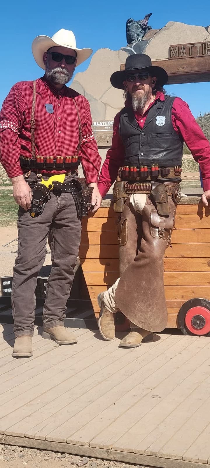 Cowboy action shooters in period western dress representing the western heritage behind Custom Gunworks