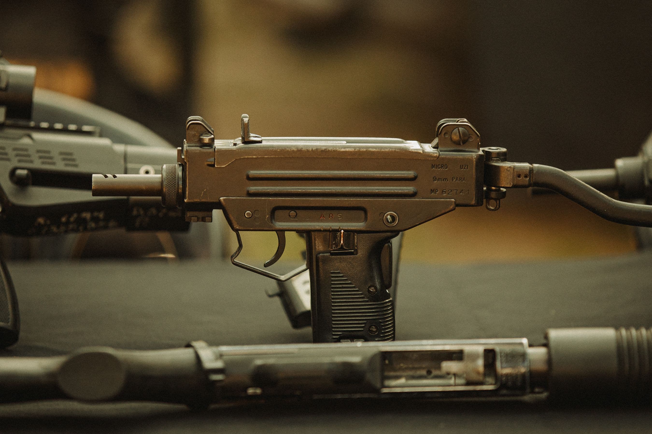 Close-up of a compact pistol shown disassembled with its component parts.
