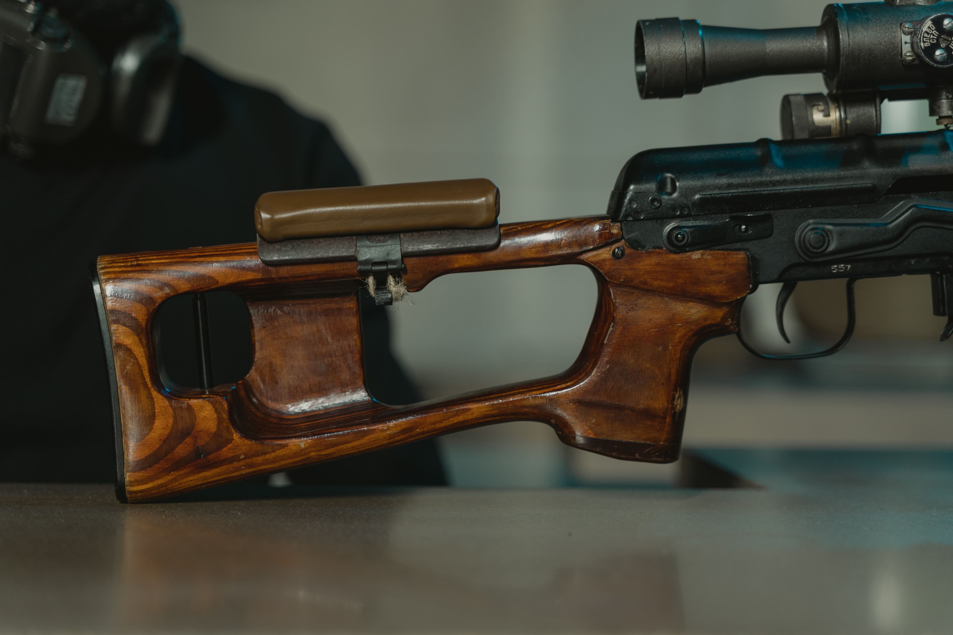 Close-up of a scope mounted on a rifle.