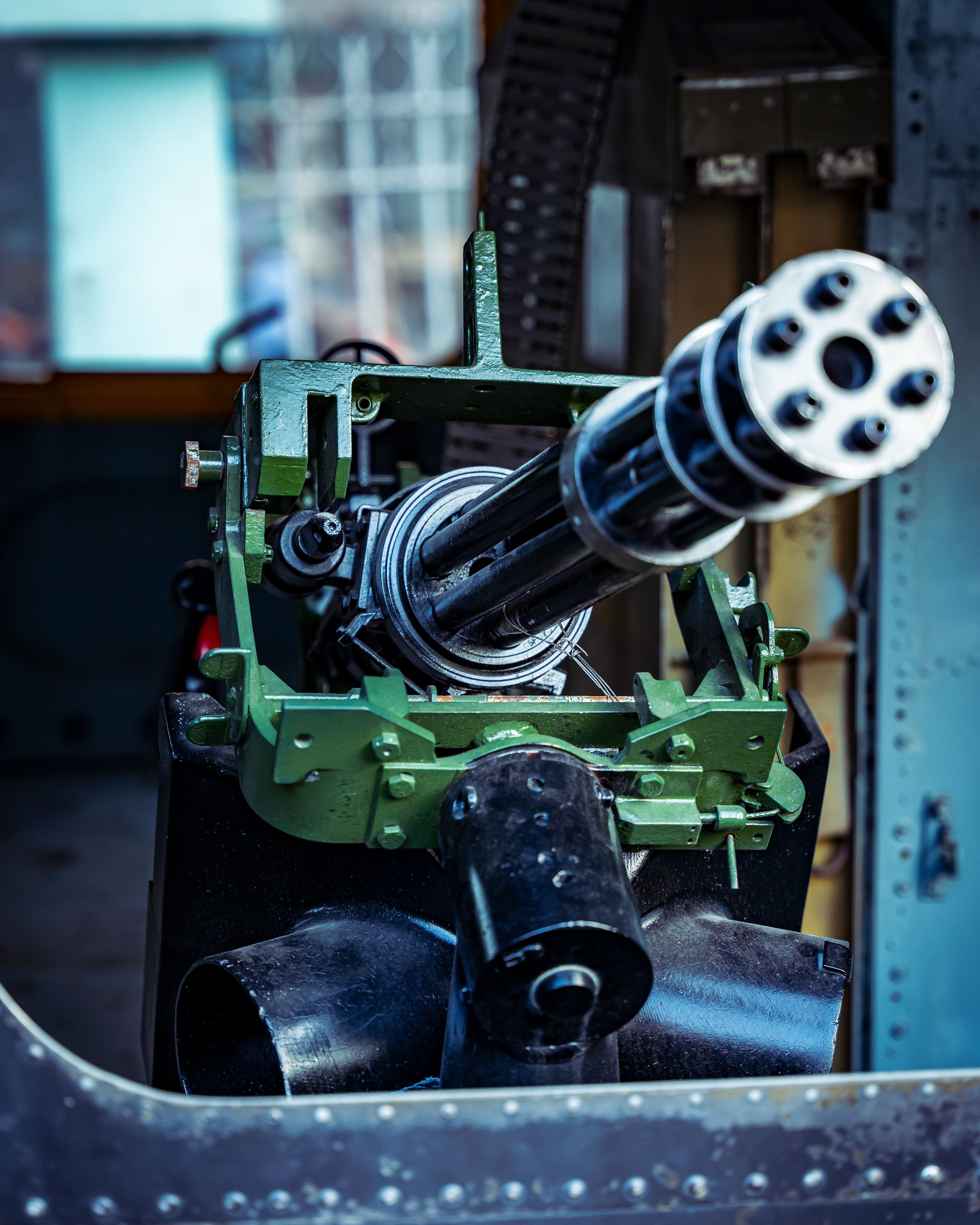 Close-up detail of stacked metal gun barrels catching the light.